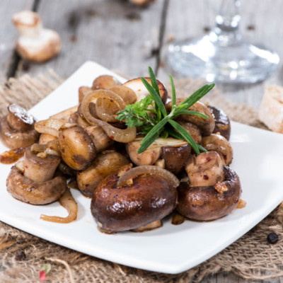 Fried Mushrooms with herbs and onions on a plate